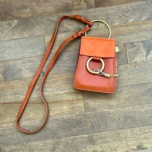 Unbranded crossbody bag with chain and ring